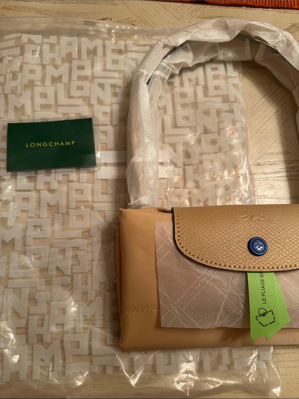 Stylish Crossbody Bag in Beige with Blue Snap - Picture 5 of 8